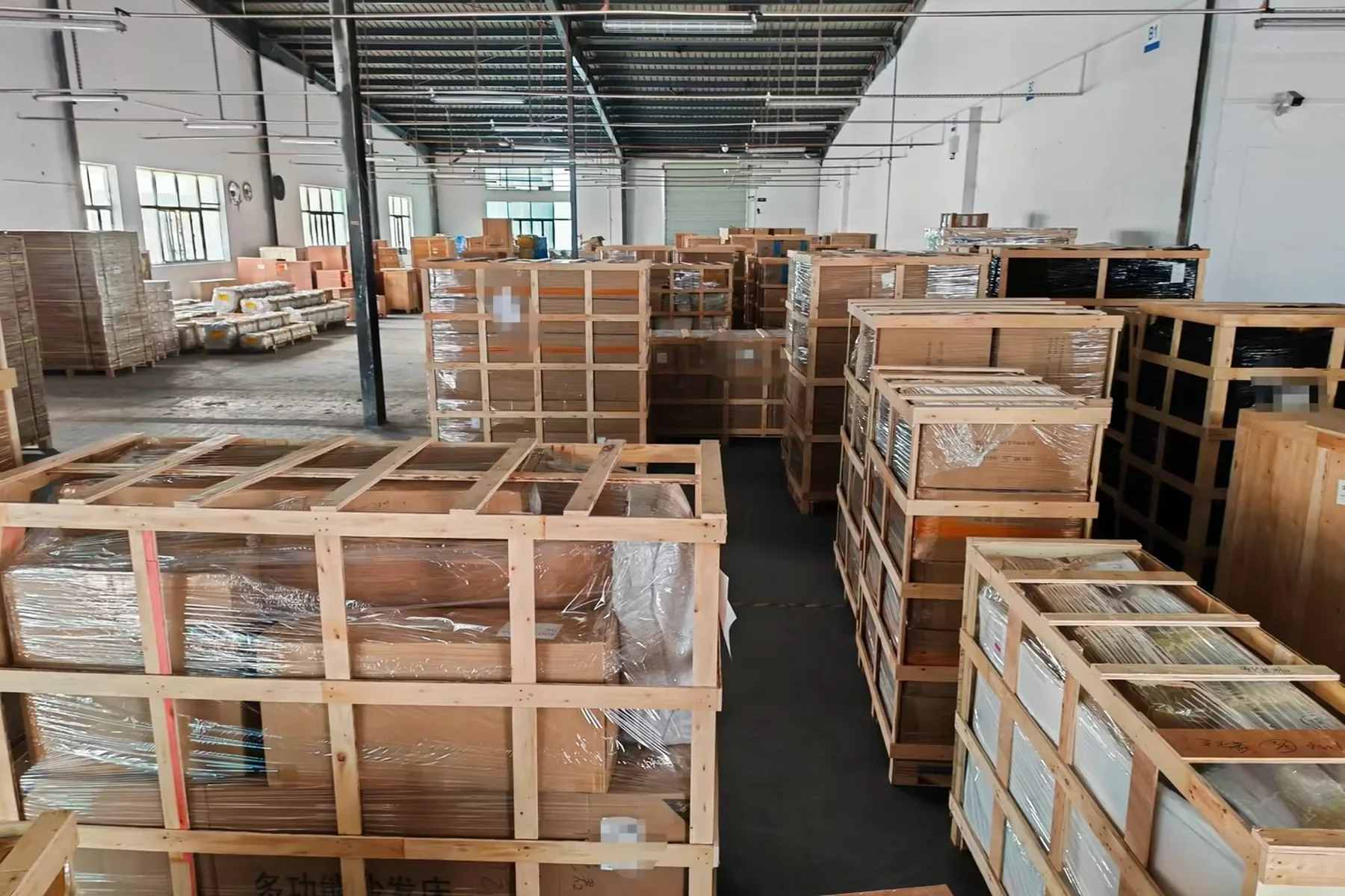 Warehouse team measuring the packed dimensions of a large crate